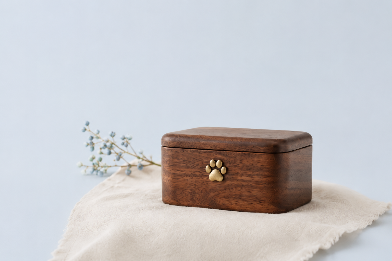 Walnut pet memorial keepsake box with brass paw emblem